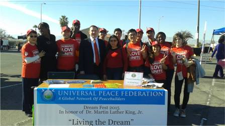 Mr. Ricardo de Sena (center), President, UPF USA, Stands With Volunteers Promoting Dr. King Jr.'s Legacy