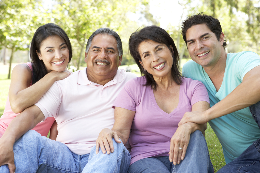 Grandparents With Adult Children In Park